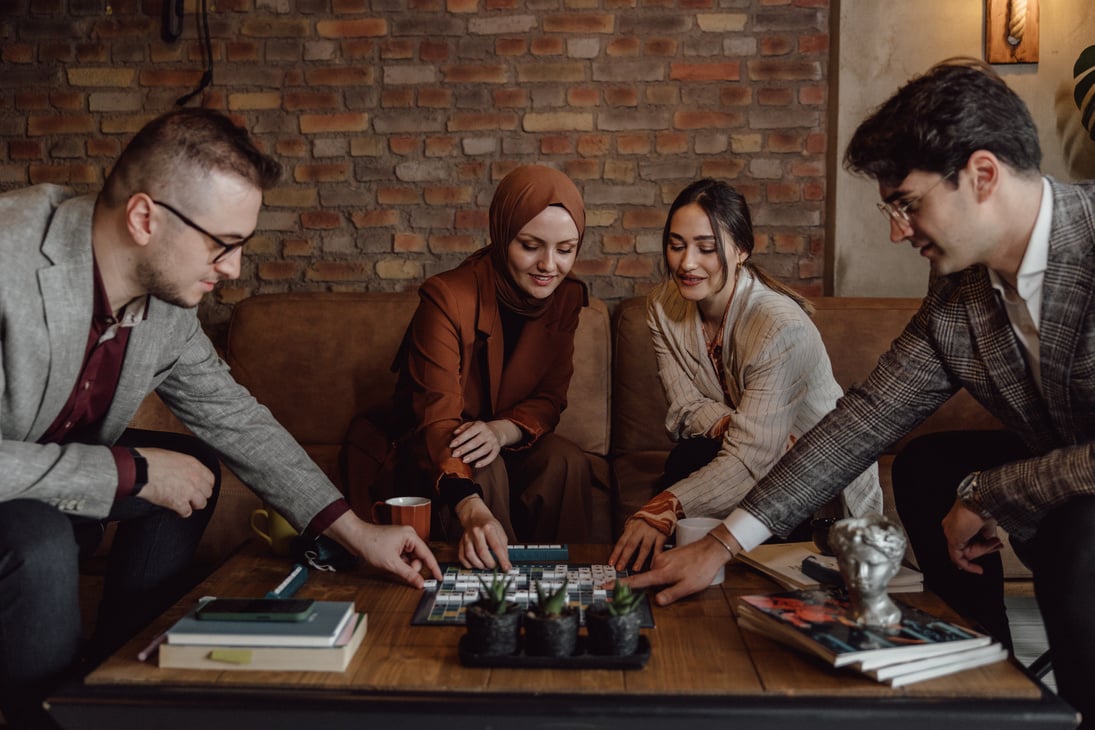 Diverse Group Playing Board Game  at Workplace 